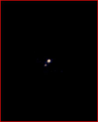 Plutón y Caronte a Color, foto tomada por la misión News Horizons